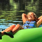 young girl enjoying sun in tube Indian Head Canoeing Rafting Kayaking Tubing Delaware River
