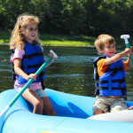 two young kids in blue raft on Delaware River Indian Head Canoeing Rafting Kayaking Tubing Delaware River