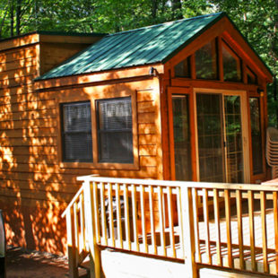 log cabin and deck on the Delaware River on a sunny day