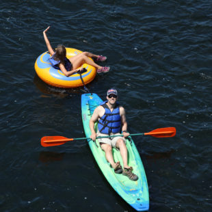 dad in kayak with daughter following in tube Indian Head Canoeing Rafting Kayaking Tubing Delaware River