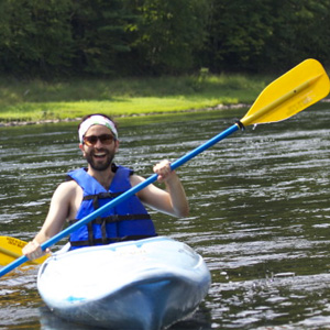 bearded man enjoying kayak ride to Pond Eddy Indian Head Canoeing Rafting Kayaking Tubing Delaware River