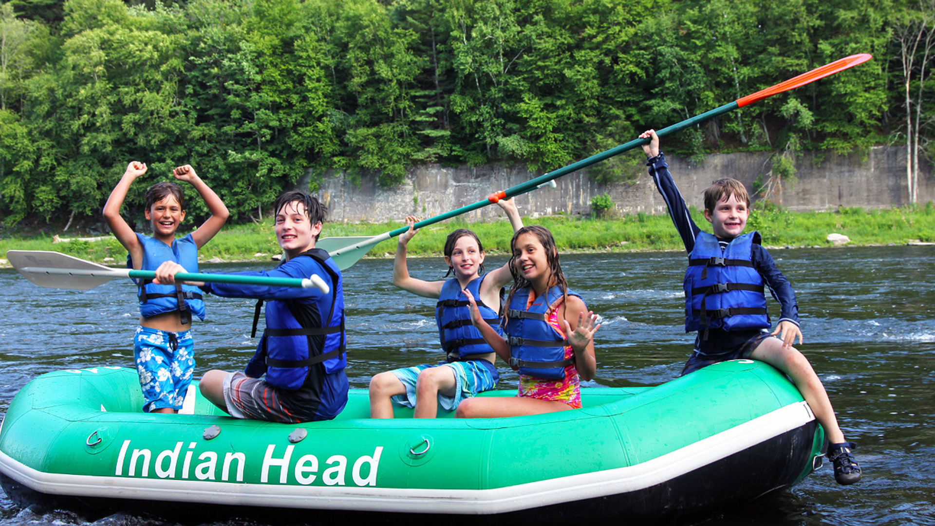 kids in raft celebrate after arriving to shore Indian Head Canoeing Rafting Kayaking Tubing Delaware River