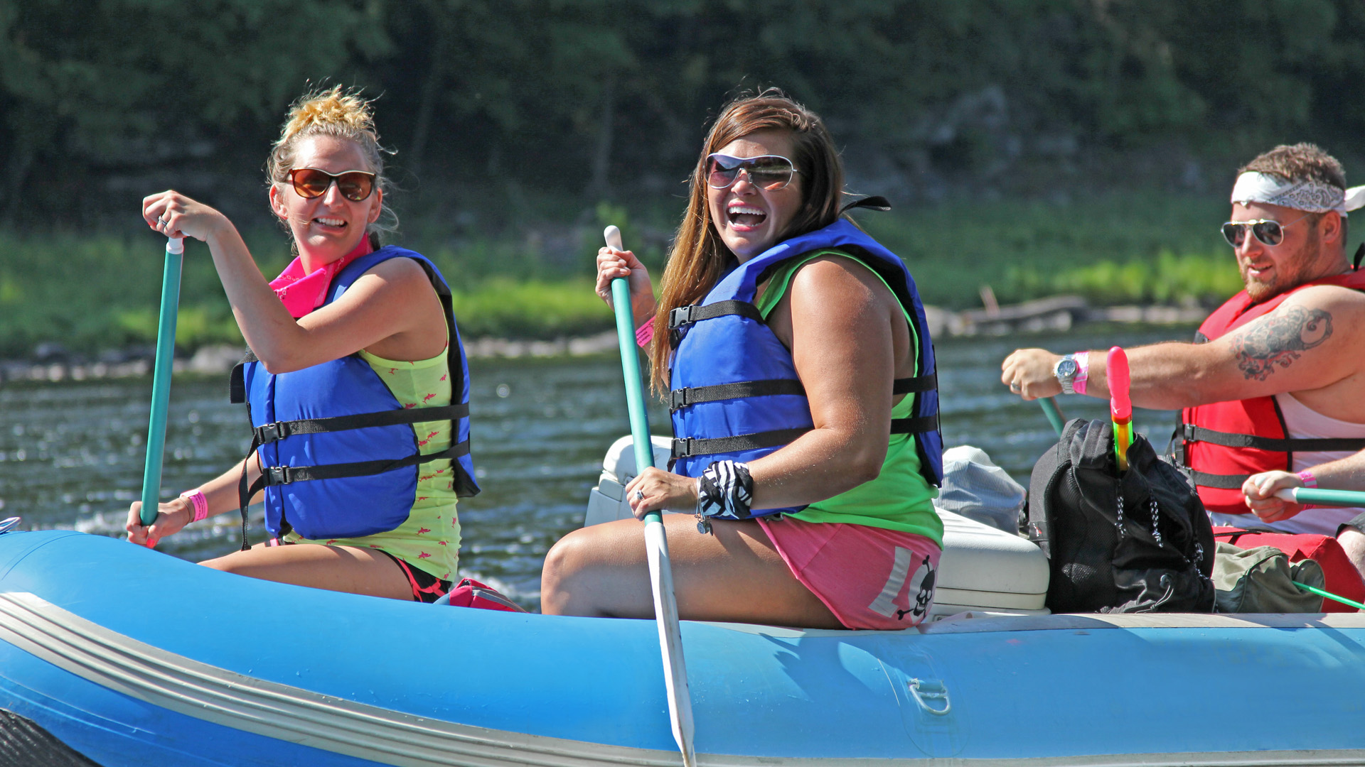 friends in raft enjoying a sunny day Indian Head Canoeing Rafting Kayaking Tubing Delaware River