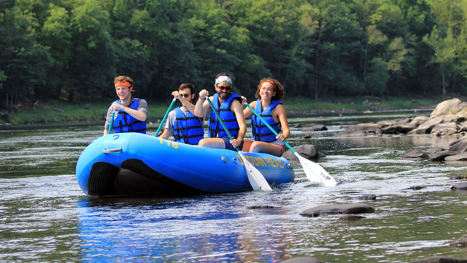 group of four in raft on the Delaware River - Indian Head Canoeing, Rafting, Kayaking, and Tubing on the Delaware River