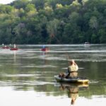 fisherman in his boat shad fishing at Knights Eddy